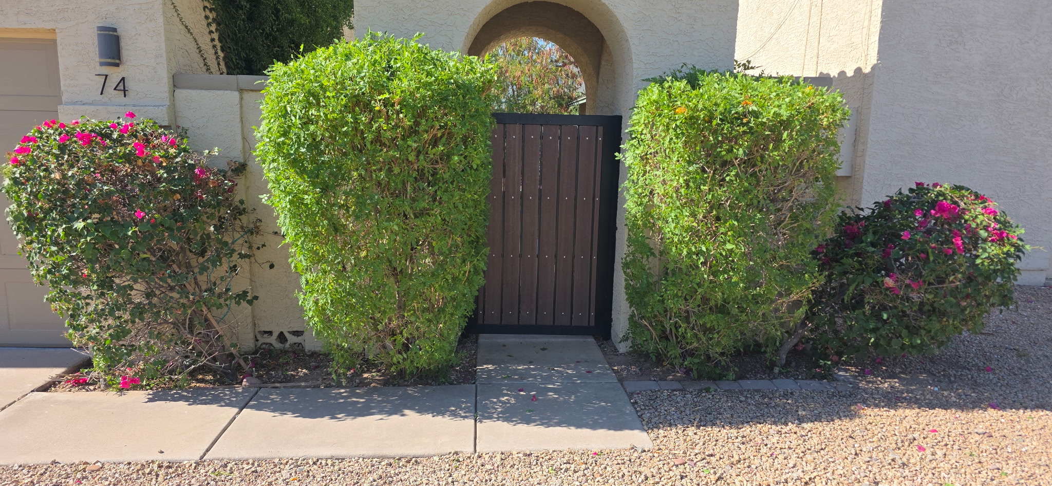 After landscaping cleanup of overgrown plants by Smiley's Landscaping LLC